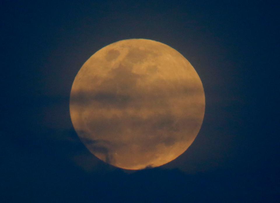  The moon rises in a rare phenomena that combines a super moon, a Blue Moon and a total lunar eclipse in Legazpi city around 200 miles southeast of the Philippines capital Manila