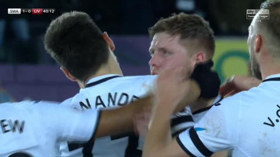  A Swans star jumped on Fernandez and caused him to headbutt the goalscorer on the shoulder