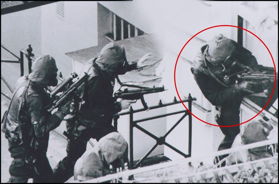 The SAS hero, circled, was known as ‘Backdoor Bob’ after bravely storming the rear door of the Embassy whie comrades abseiled from the balcony