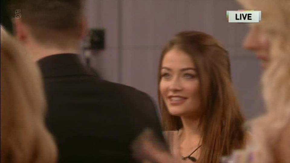  Jess grinned as Jonny walked away after greeting her