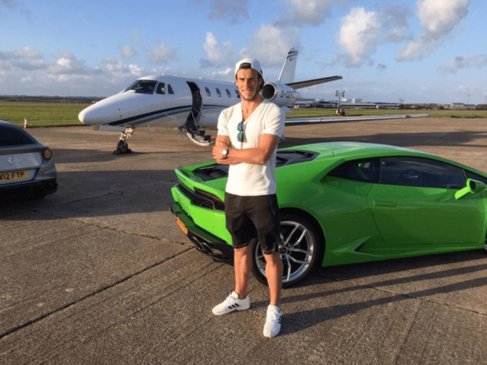  Gareth Bale stands beside a Lamborghini, Ferrari and private jet