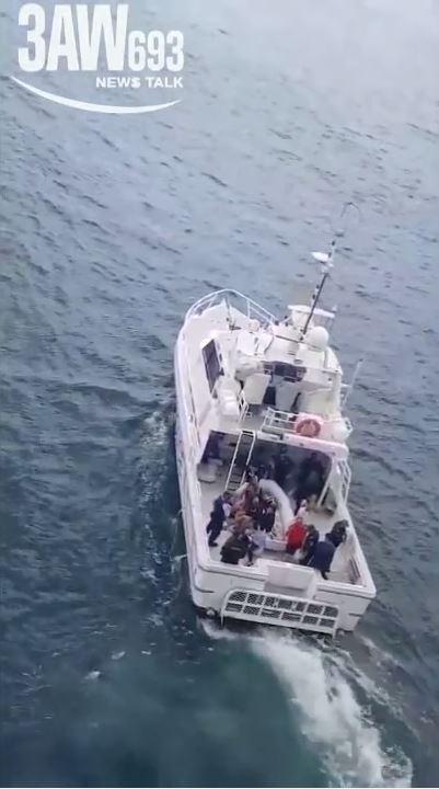 Pictured is the moment a group of men and teenagers believed to be involved in the violence are kicked off the ship