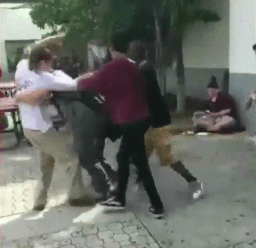 Nikolas Cruz, wearing the white T-shirt, is seen 'fighting with a love rival'