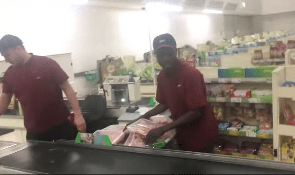  It shows the fake workers stocking up on chicken in the supermarket