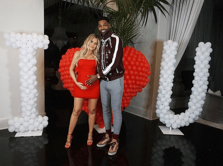  Khloe recently posed for a sweet picture with her boyfriend Tristan as they caressed her growing baby bump