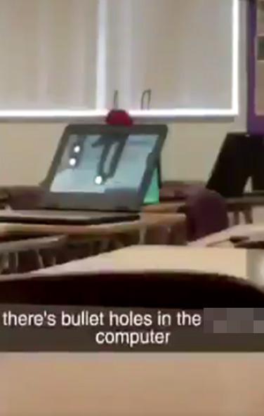  Mobile phone footage showed bullet holes pierced through a computer screen