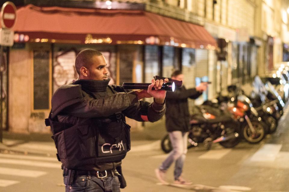 An armed cop at the scene of the 2015 terror atrocity