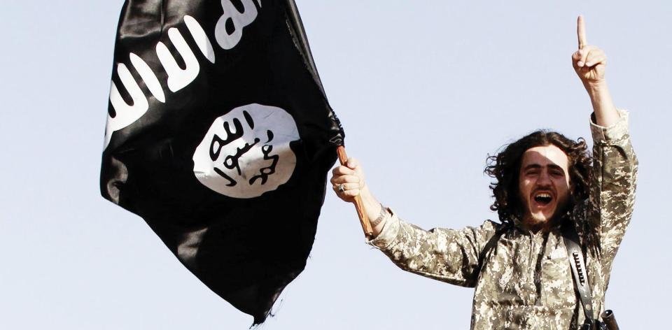  Islamic State of Iraq and the Levant propaganda shows a solider waving a flag