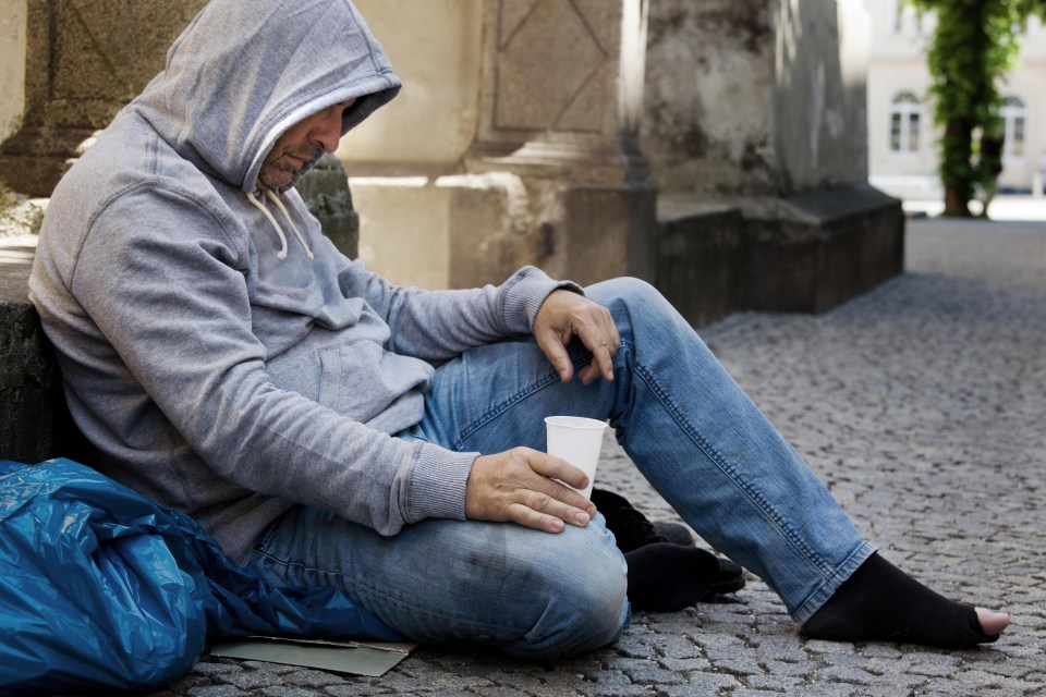 The homeless man was attempting to collect pennies to pay for his train ticket home, police claim