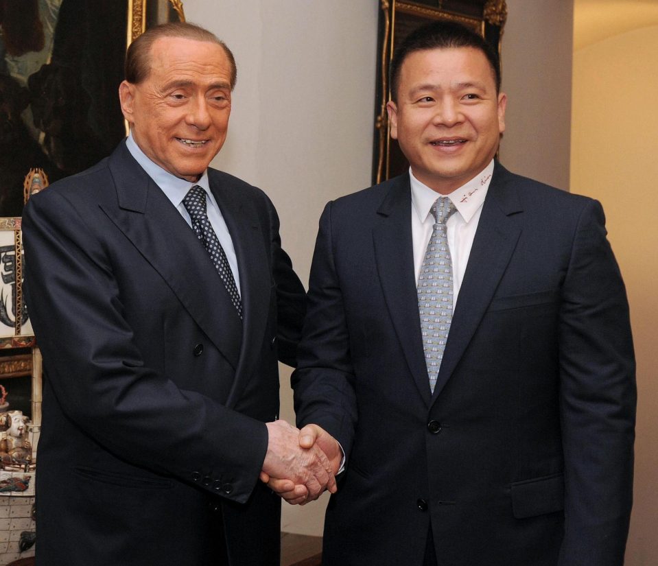  AC Milan owner Yonghong Li, pictured (right) with predecessor Silvio Berlusconi, faces big money problems