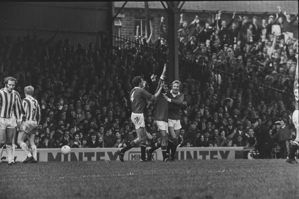  Denis Law and George Best celebrate during a 3-0 win against Huddersfield in 1971