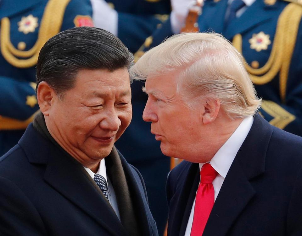  Donald Trump chats with Xi Jinping during a welcome ceremony at the Great Hall of the People in Beijing