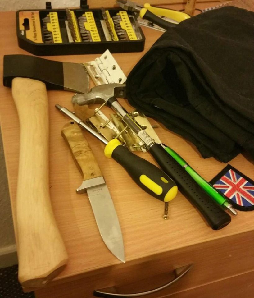  Weapons are seen lying on a table in footage taken by cops searching his home