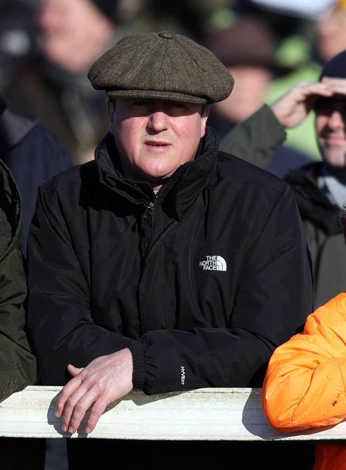  David Cameron's flat cap is way too big for him