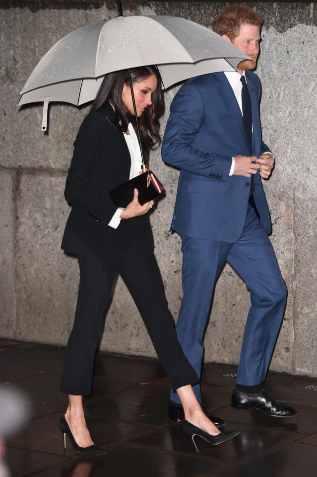  The royal-to-be covered herself from the rain under a silver umbrella