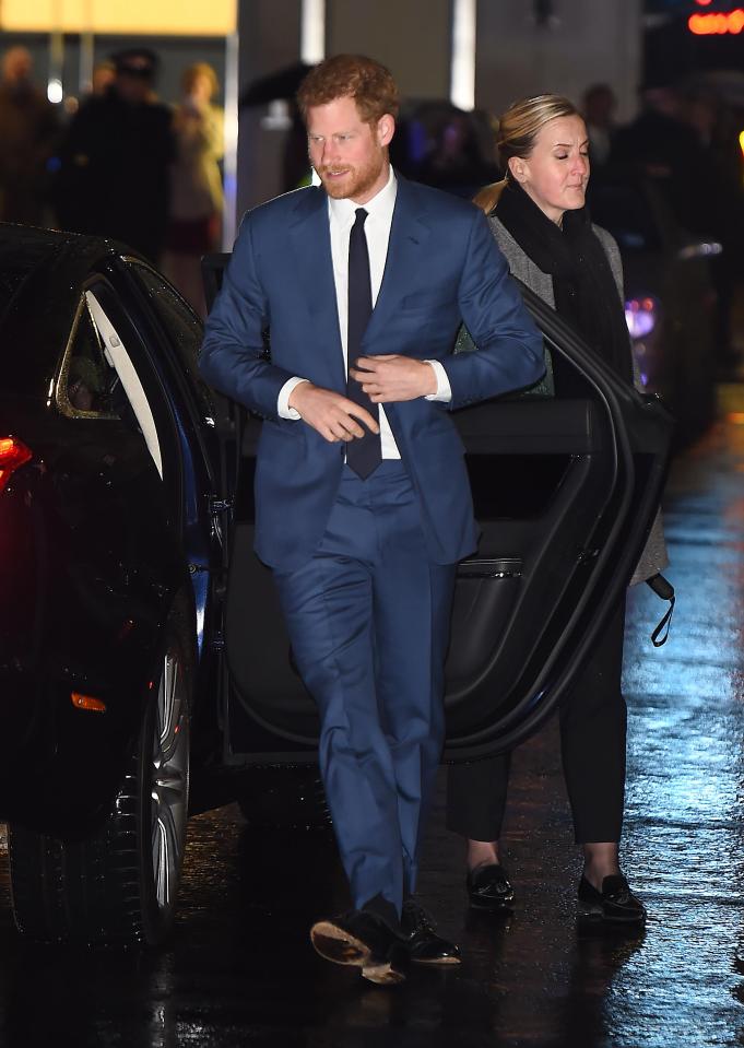  Prince Harry wore a blue suit while his fiancée opted for black