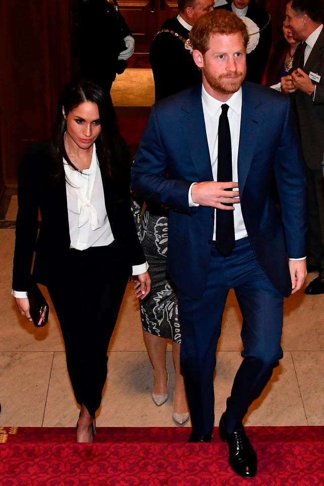  The US actress following fiancée Harry up the stairs at Goldsmiths Hall in London