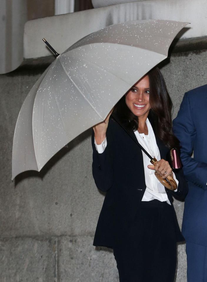  Before that Meghan beamed as she prepared to meet supporters of the Endeavour Fund despite the rainy weather