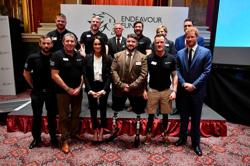  Britain's Prince Harry and his fiancee US actress Meghan pose with award winners Ben Lee (third from right), Sean Gane (back second left) and Daniel Claricoates (back third left) and the award nominees