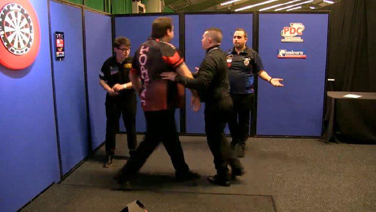  Adrian Lewis was fuming at the end of the game, and had to be restrained by darts officials