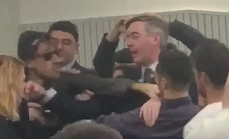  Protester Josh Connor is seen throwing a punch narrowly missing Jacob Rees-Mogg