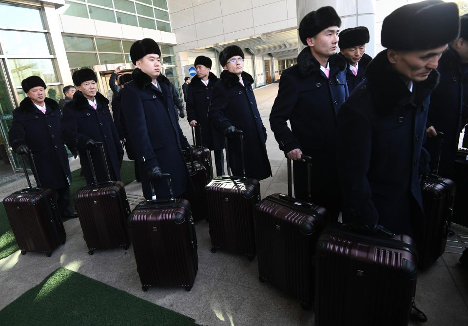  An advance group of North Korea's 140-member Samjiyon Band arrive at the Korea-transit office just before crossing over in South Korea