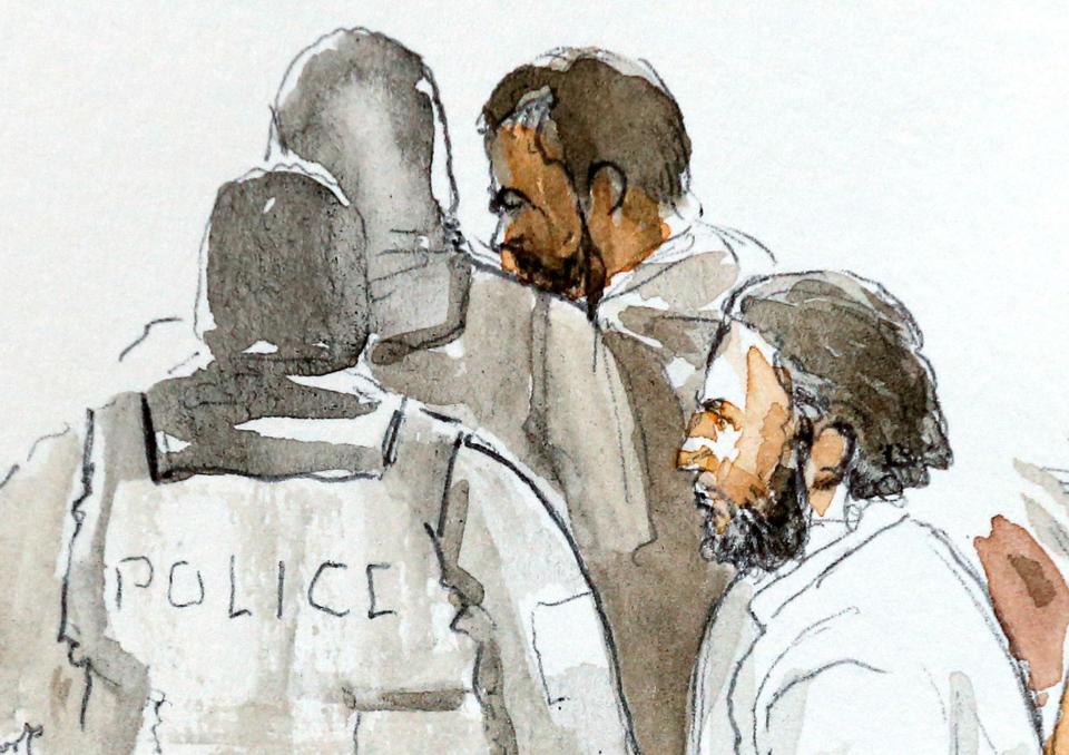 A courtroom sketch shows the terror suspect flanked by elite cops