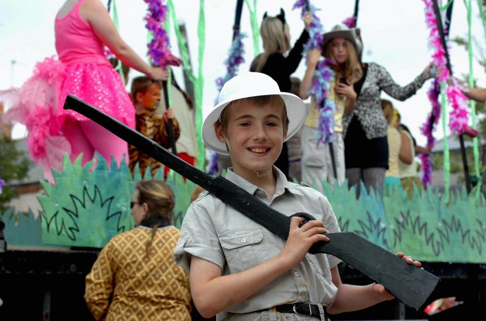  Ethan Stables is pictured as a child, smiling as he brandishes a mock firearm