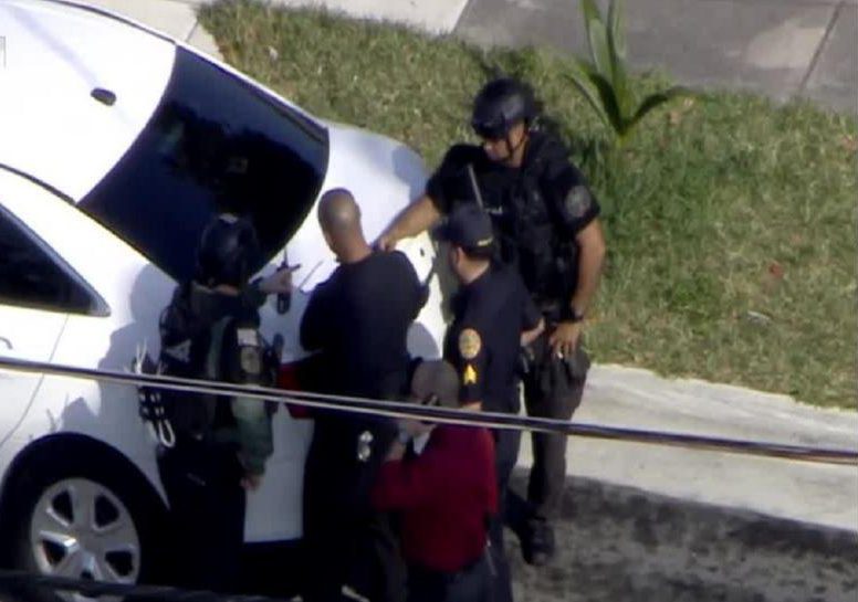  Officers are seen at the scene of the ongoing hostage situation in Miami