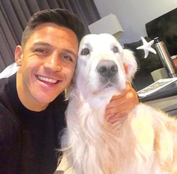  Alexis Sanchez takes a snap of himself with dog Humber