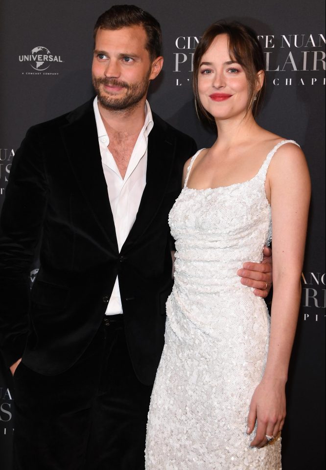  The actor posed for pictures with his on-screen wife Dakota Johnson