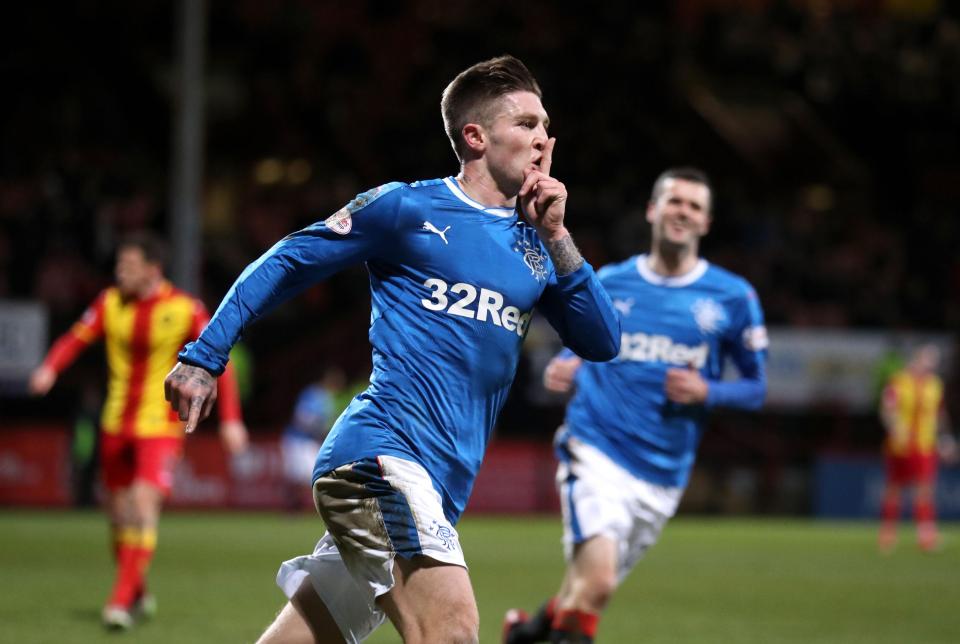  Josh Windass puts his fingers to his lips as he runs towards the Rangers fans