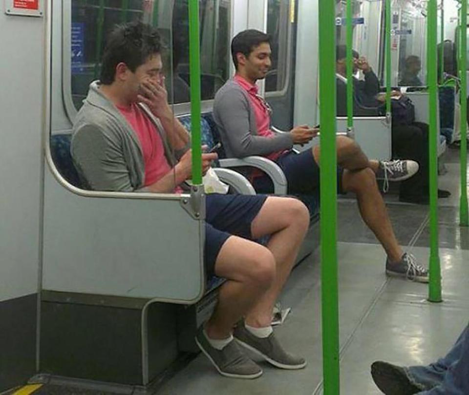  These two lads on the Tube can see the funny side of choosing identical outfits