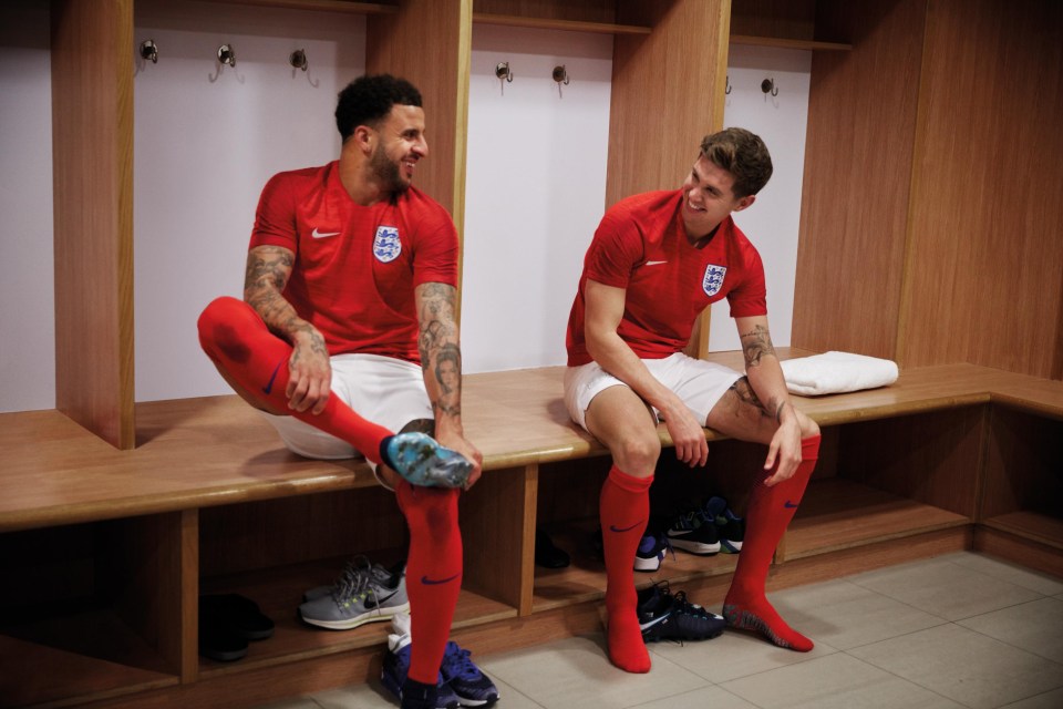 Kyle Walker (left) and John Stones (right) look delighted with the new retro red away kit