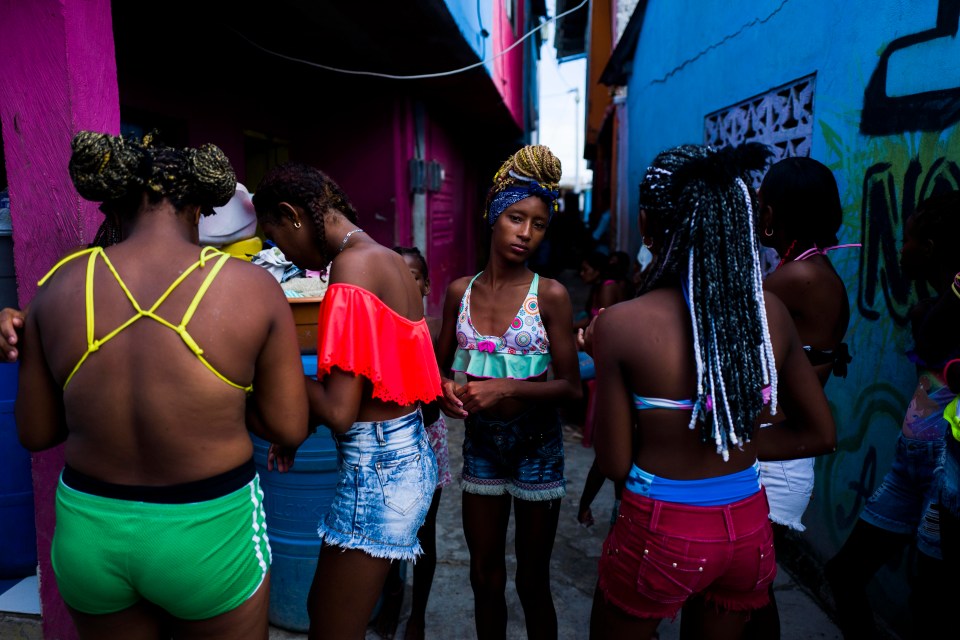 A young girl and her friends show off their dramatically different hairstyles