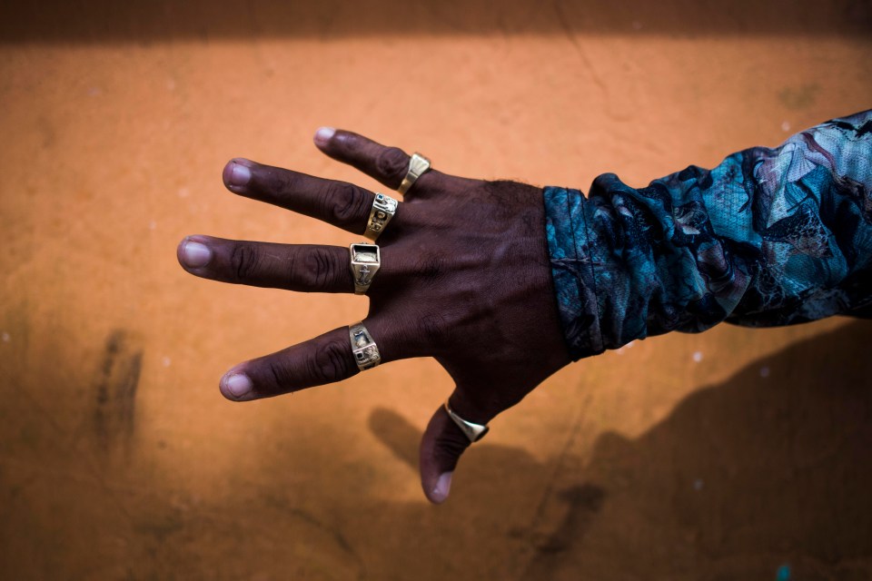 A man shows off his gold rings - and says he's not afraid of using them