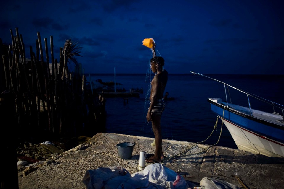 One boy cools himself off with seawater