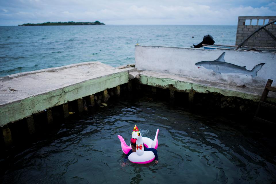  A young child escapes the hustle and bustle of the island for some peace