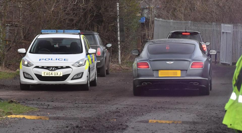  The cops were on the back private land, where United's stars drive in and out of training