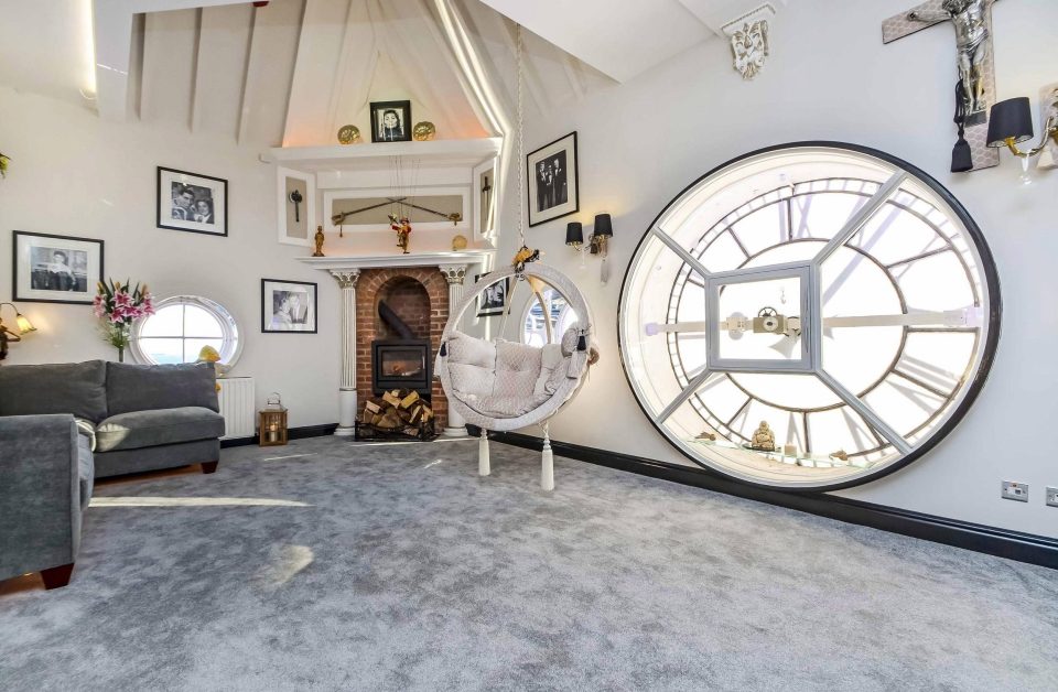  The tower's clock face makes a striking centre-piece in the flat's lounge