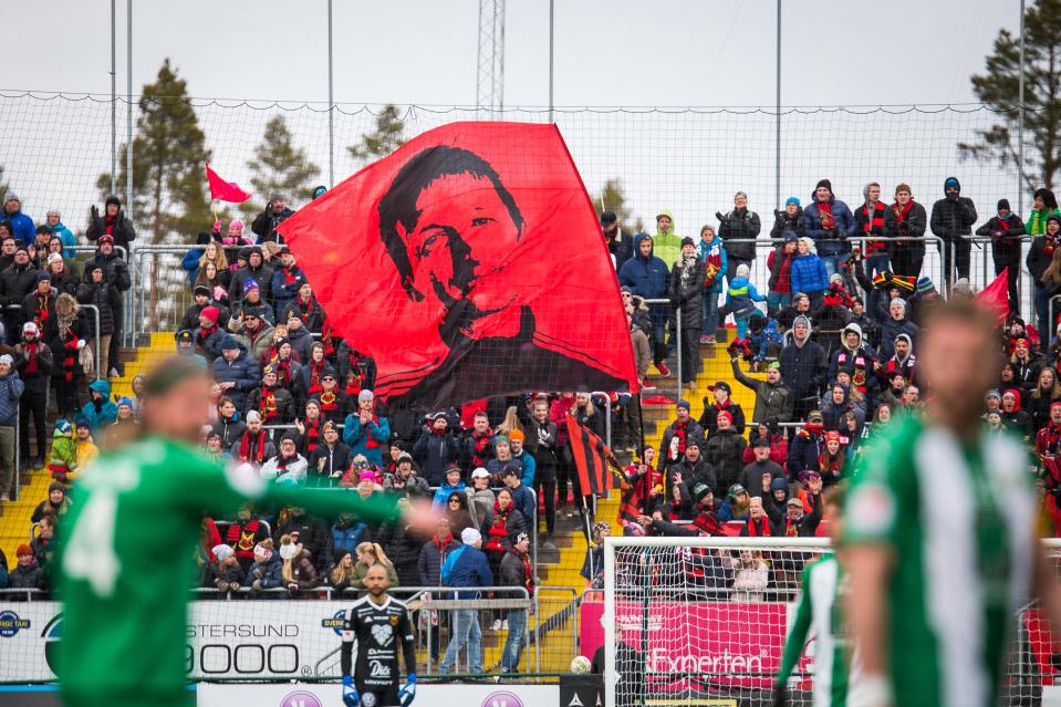  Ostersunds fans fly a flag with Potter's face during a game with Hammarby