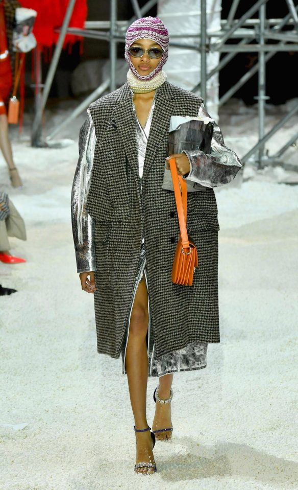  A statement check coat was given a space-age feel with silver metallic sleeves