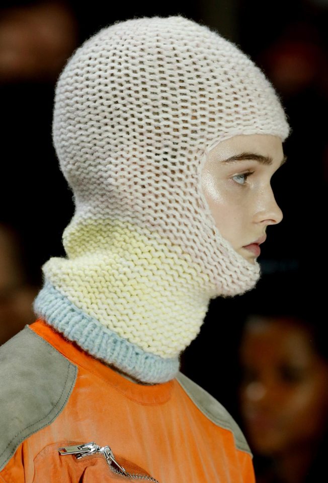  Model's face peeks out from a hand-woven balaclava