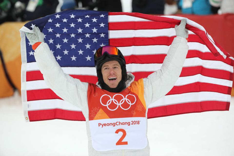  Shaun White celebrates after winning a record third snowboard gold