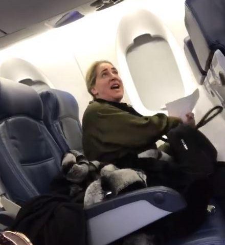  Footage shows a passenger arguing with staff before being kicked off a flight