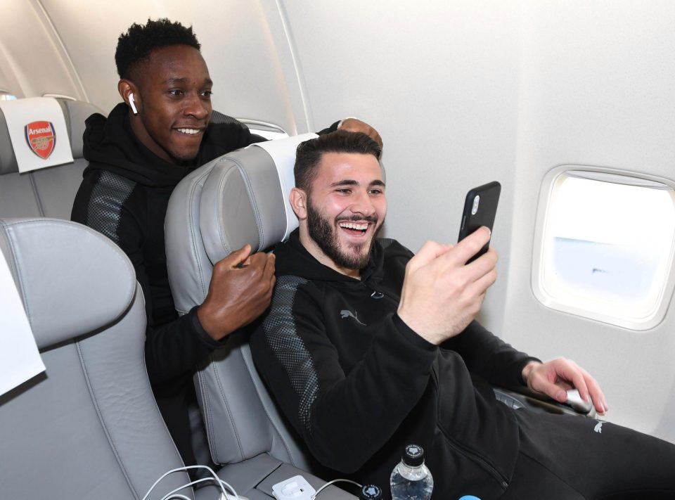  Arsenal duo Sead Kolasinac and Danny Webeck share a joke on the plane to Sweden