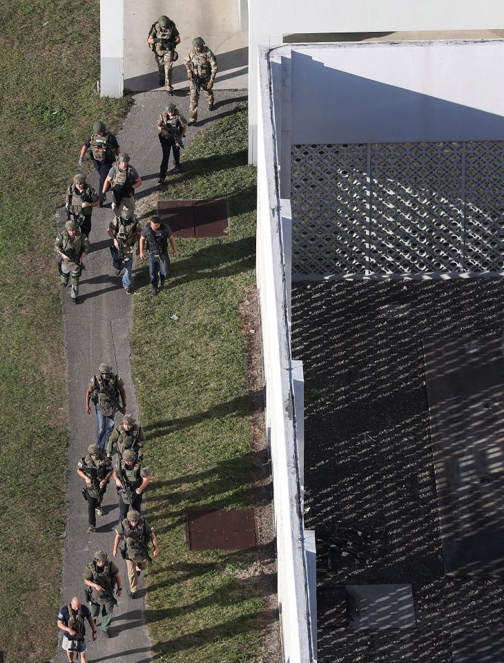  Police officers in helmets, bulletproof vests and armed with automatic weapons could be seen stationed at several points around the sprawling school complex