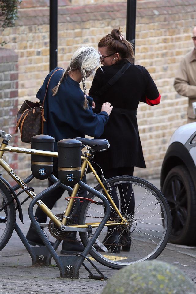  Joanne stopped to adjust her daughter's sling