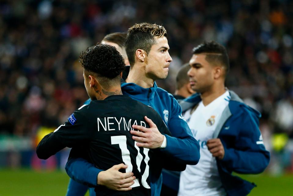  Neymar shares an embrace with Cristiano Ronaldo after Real Madrid beat Paris Saint-Germain 3-1