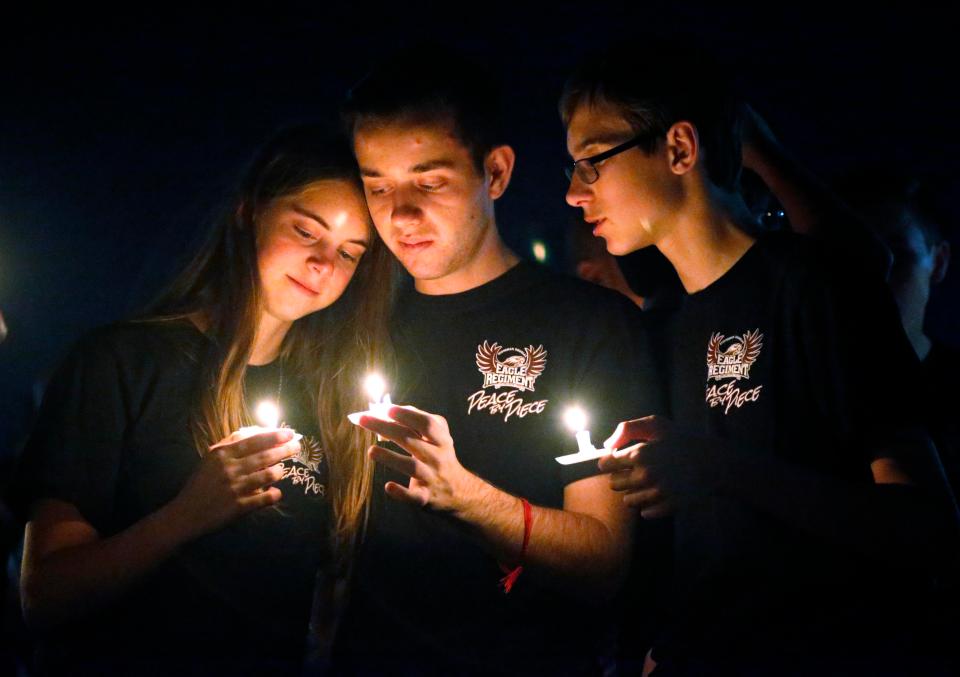  People lit candles and said prayers for the school kids and their teachers that didn't make it out alive on Valentine's Day